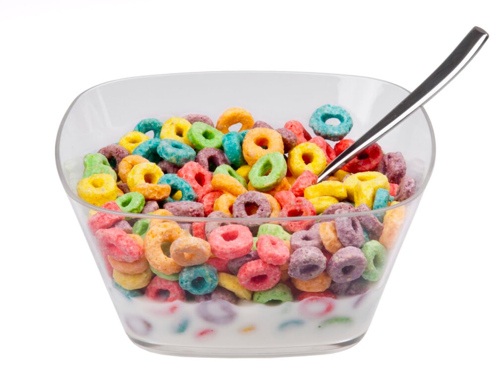 Multi-coloured fruit loops in a clear bowl